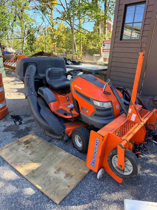 Husqvarna Gas-Powered Riding Lawn Tractor w/ Tow-Behind Spike/Plug Aerator Attachment (Orange)